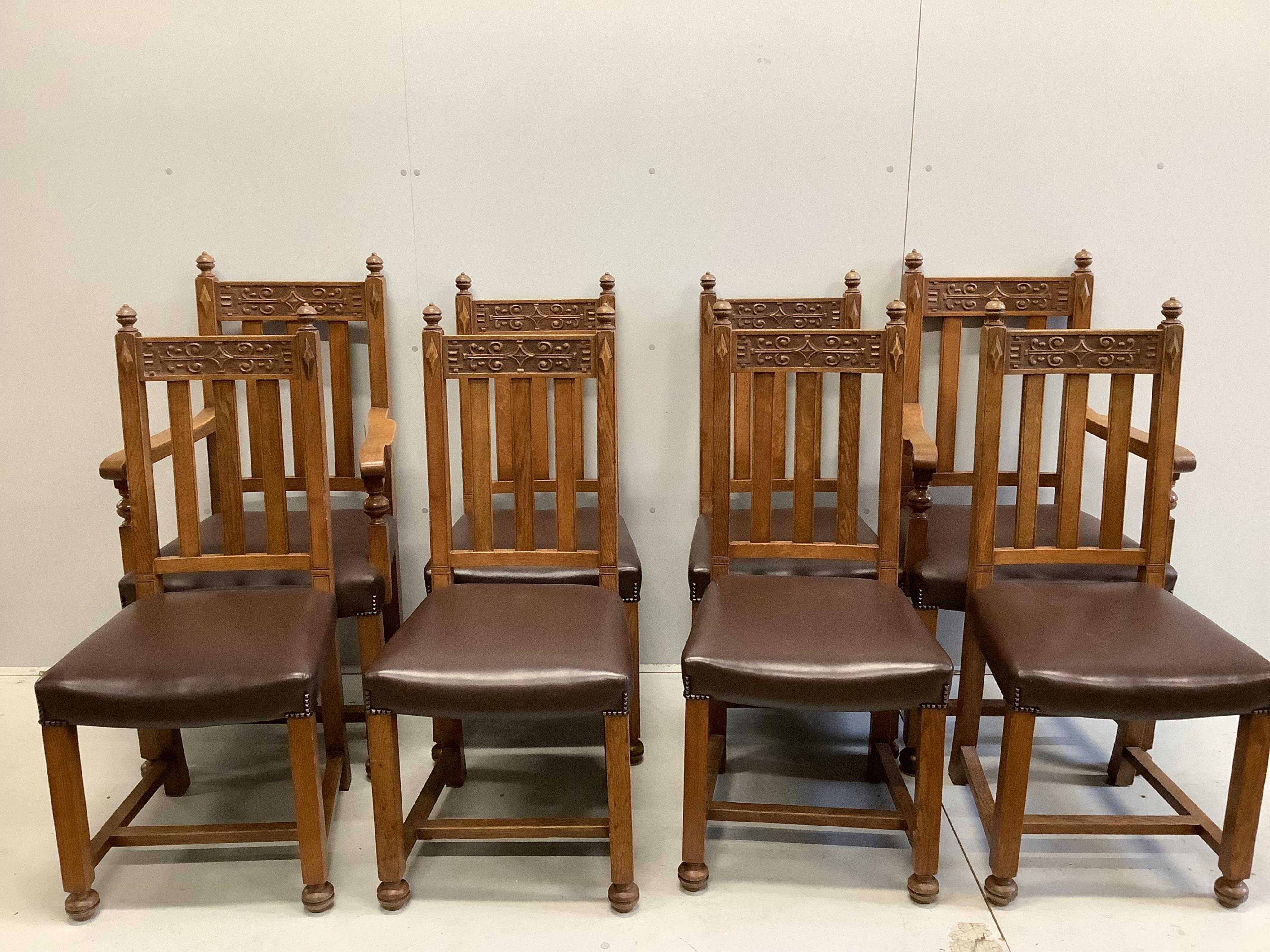 A set of eight early 20th century carved oak dining chairs, two with arms. Condition - fair to good